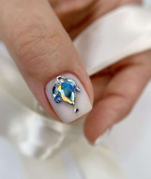 Milk manicure with rhinestones