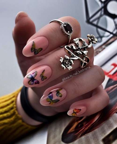 Beige manicure with butterflies