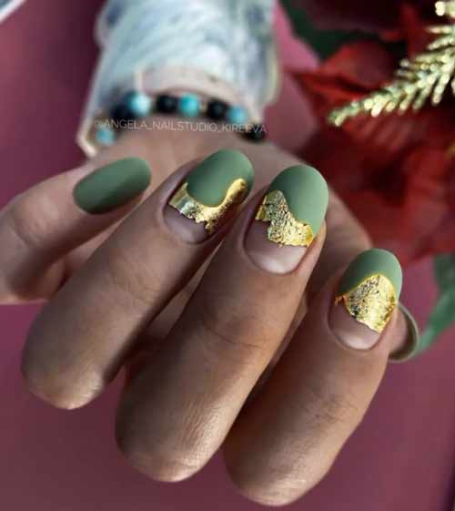 Green manicure with gold foil