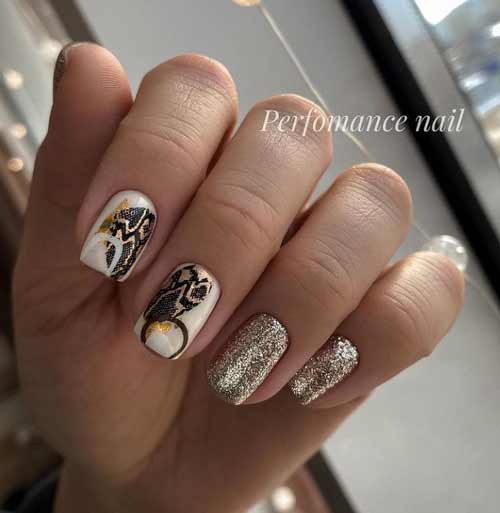 Black and white manicure with gold