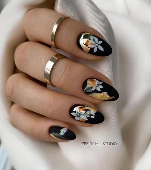 Black and gold manicure with drawings