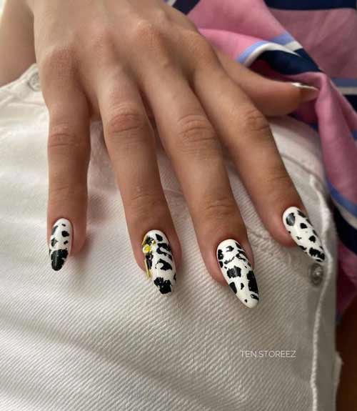 Black and white manicure with gold