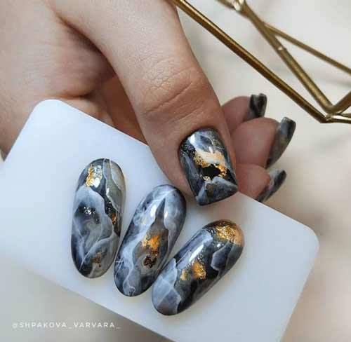 Black marble with gold manicure