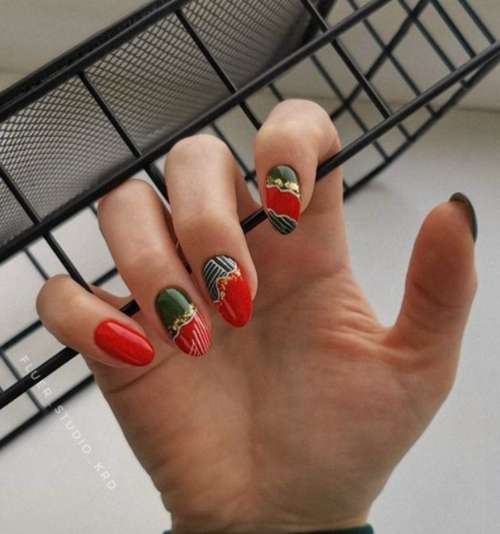 Red manicure with gold foil