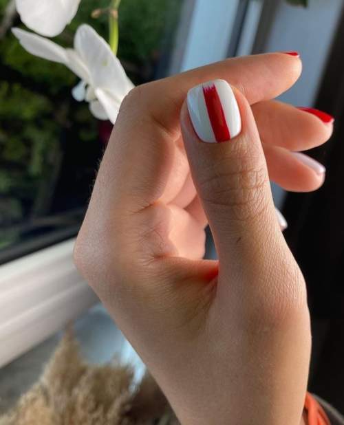 White manicure with stripes