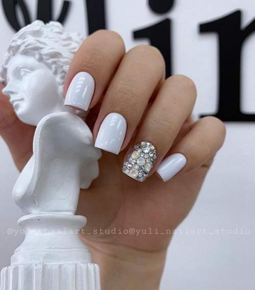 White manicure and rhinestones